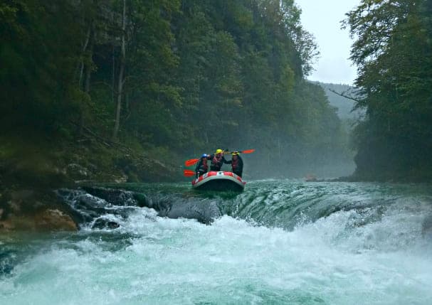  a boat floats on a mountain river